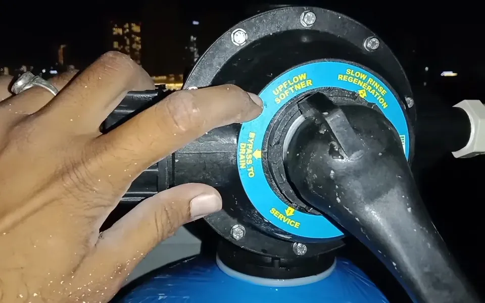 Control valve mounted on a blue water treatment tank for residential plumbing service in Bear Brand Ranch, Laguna Niguel