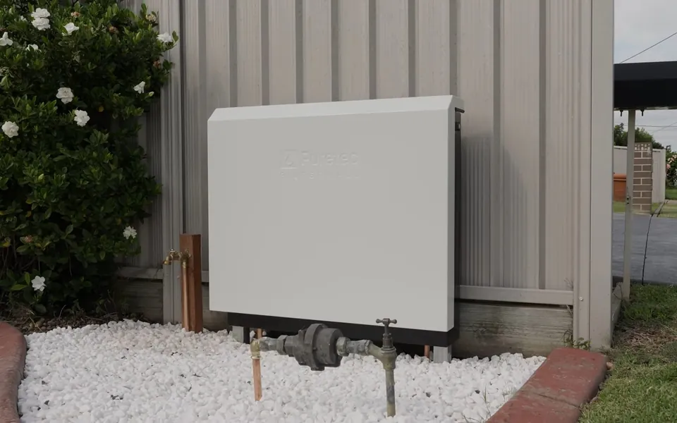 Closed outdoor whole-house filtration cabinet for residential plumbing service in Ladera Ranch