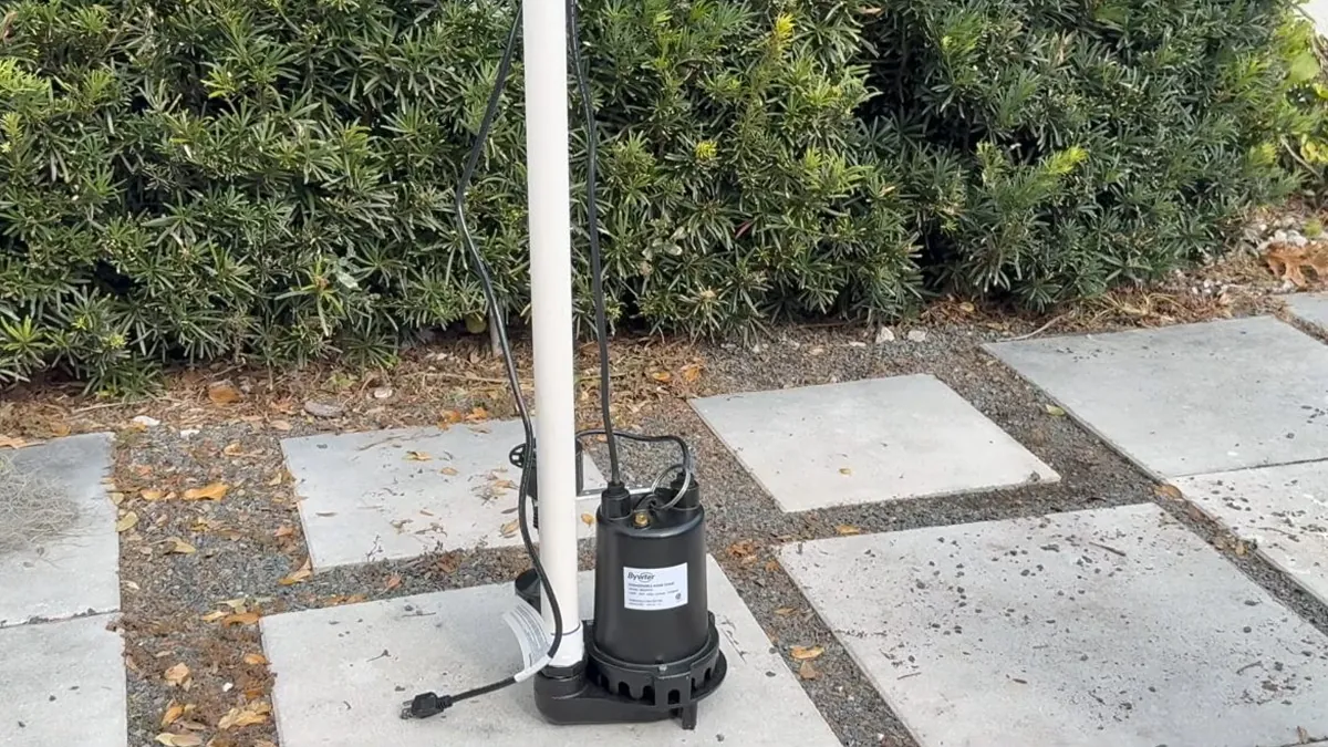 Compact pool pump and vertical discharge piping on pavers for pool leak detection repair in Laguna Niguel