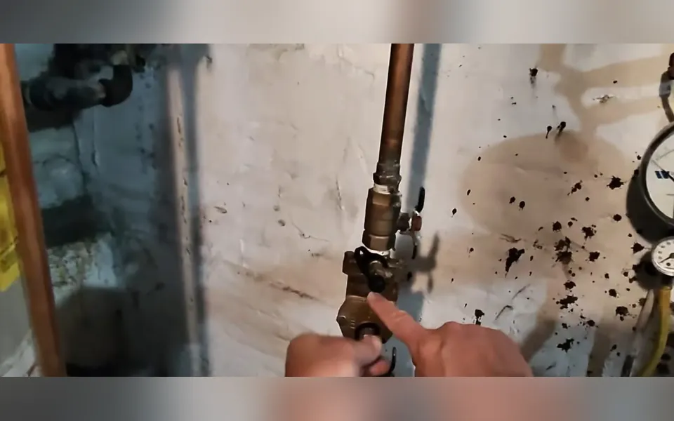 Technician tightening a valve on a copper water line for residential plumbing service in Crown Valley Parkway Corridor, Laguna Niguel