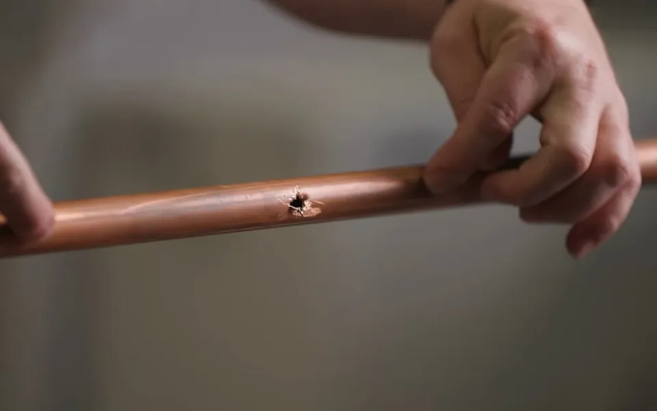 Small pinhole leak visible on a copper pipe for when is it time to repipe your home in Laguna Niguel