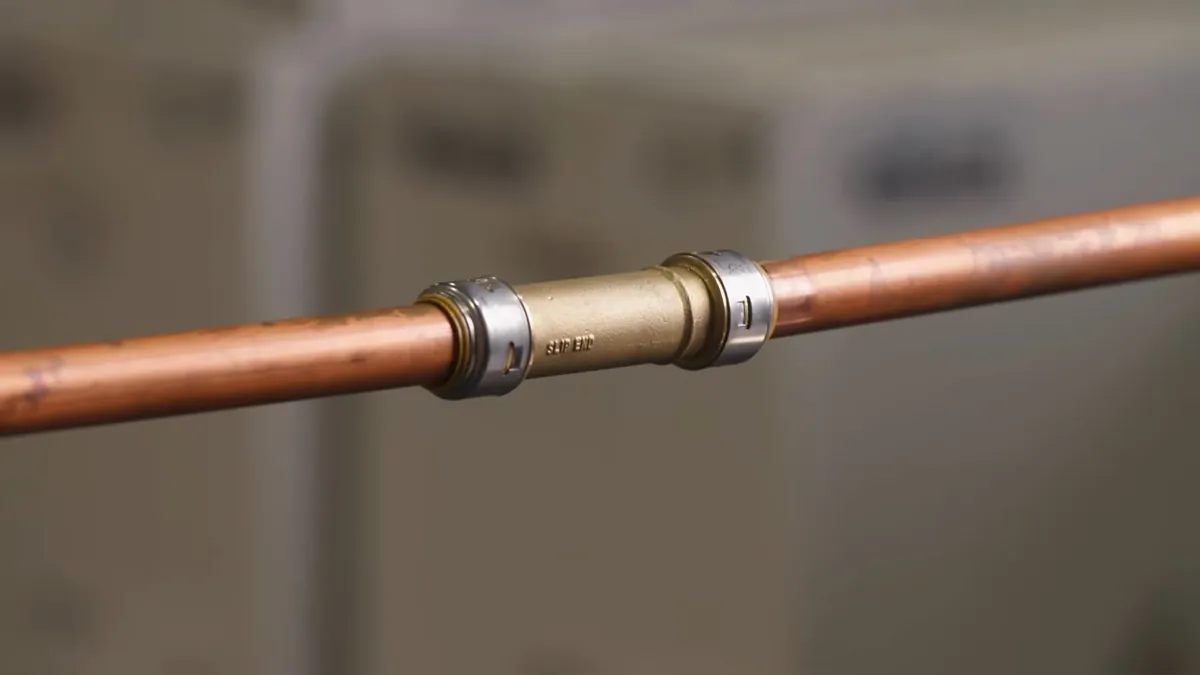 Repaired copper pipe joined with a new coupling for pipe repair replacement in Laguna Niguel