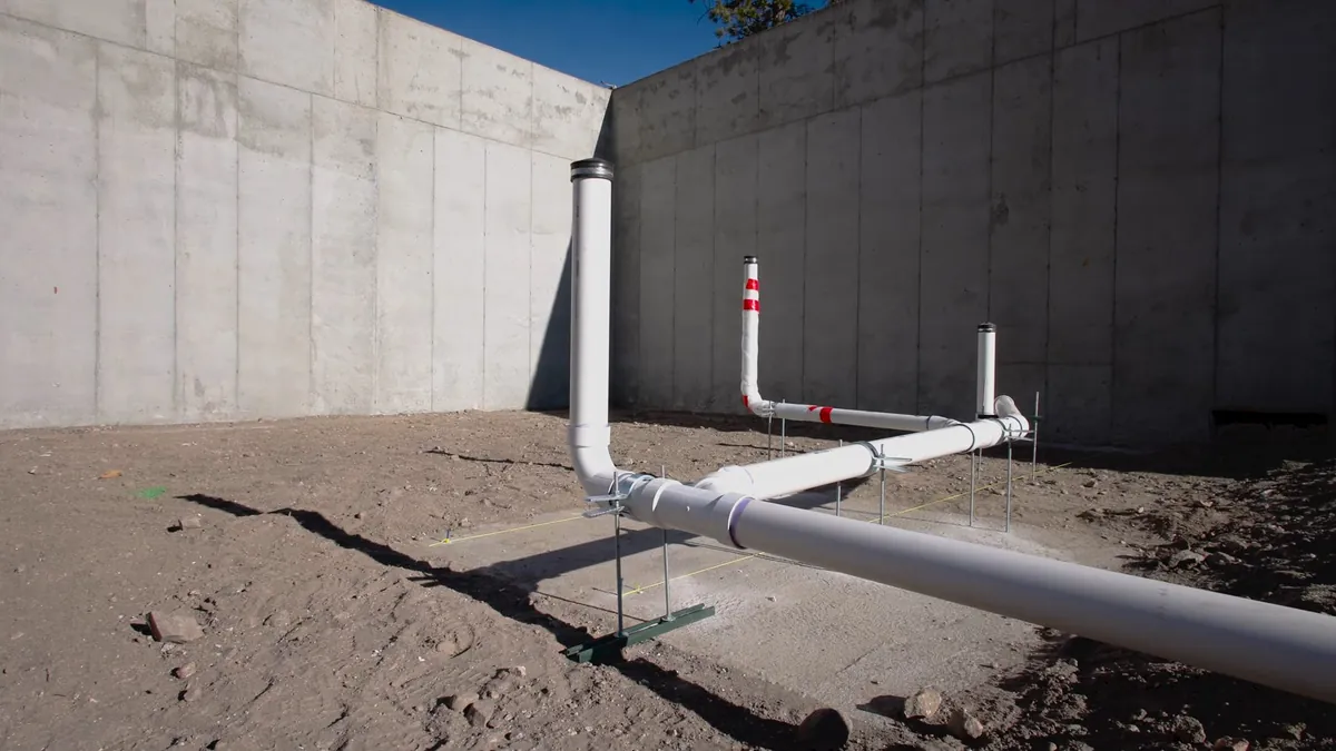 PVC underground plumbing rough-in outside a foundation for residential plumbing service in Laguna Hills