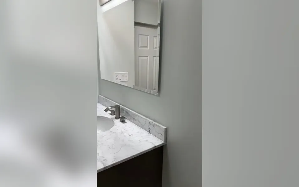 Finished bathroom vanity with sink and faucet for bathroom plumbing in Laguna Niguel