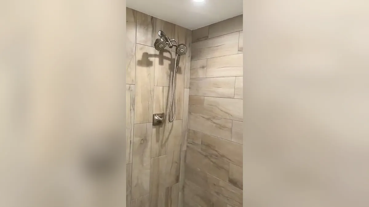 Finished tiled shower with modern fixtures for bathroom plumbing in Laguna Niguel