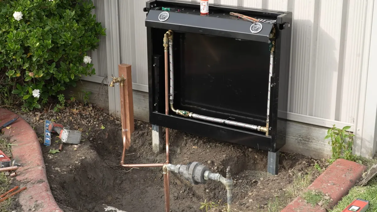 Outdoor whole-house filtration cabinet with treatment equipment for plumbing service in Laguna Niguel