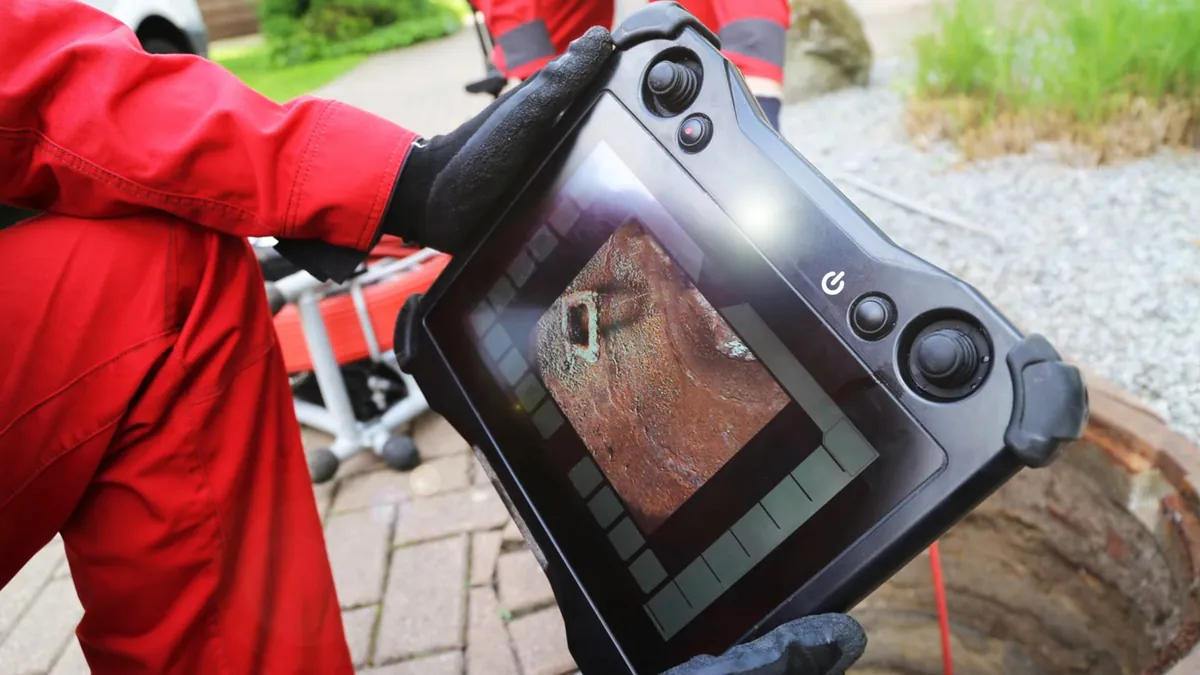 Inspection camera display used during pool pipe testing for hillside pool leaks in Laguna Niguel
