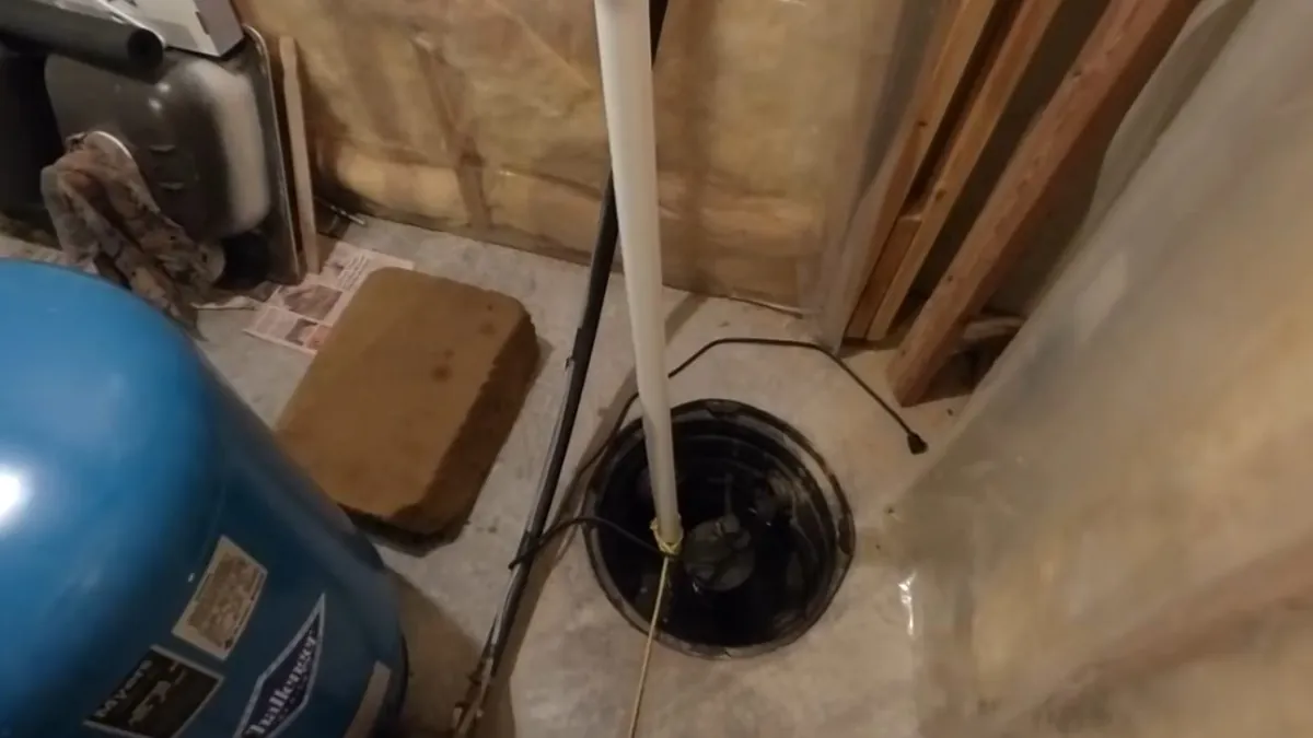Submersible pump installed inside a collection basin for residential plumbing service in Niguel Hills, Laguna Niguel