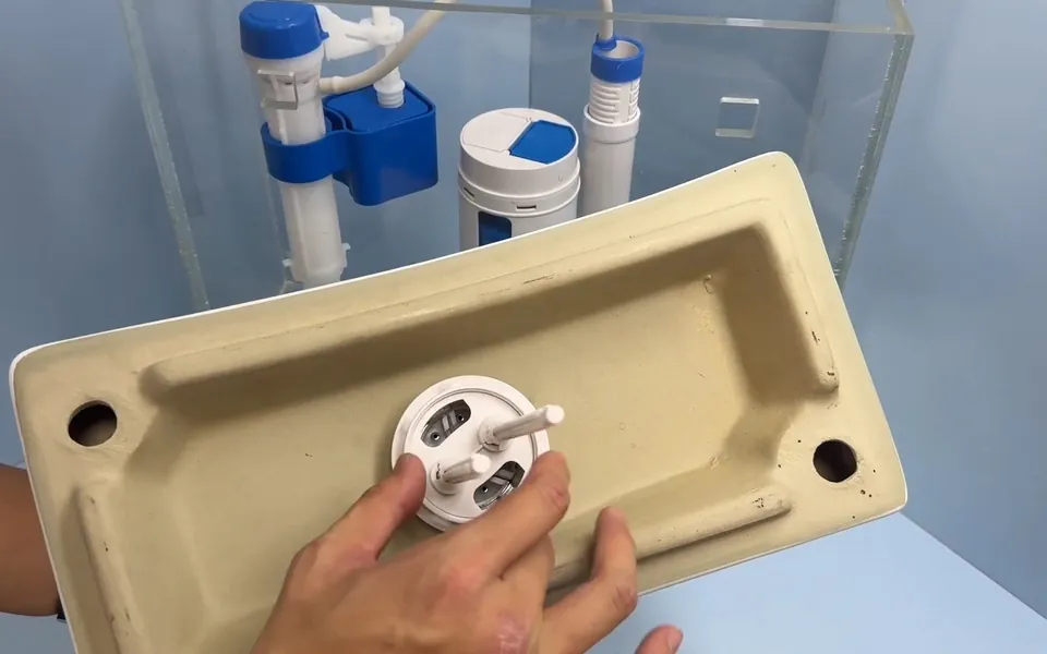 Underside of a toilet tank showing mounting and flush hardware for toilet repair replacement in Laguna Niguel