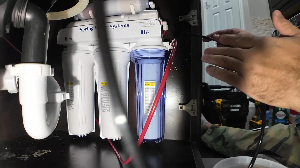 Reverse osmosis cartridges mounted beneath a kitchen sink for water filtration systems in Laguna Niguel