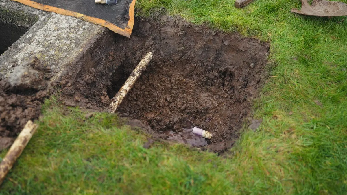 Excavated trench prepared for an underground utility line for residential plumbing service in San Joaquin Hills, Laguna Niguel