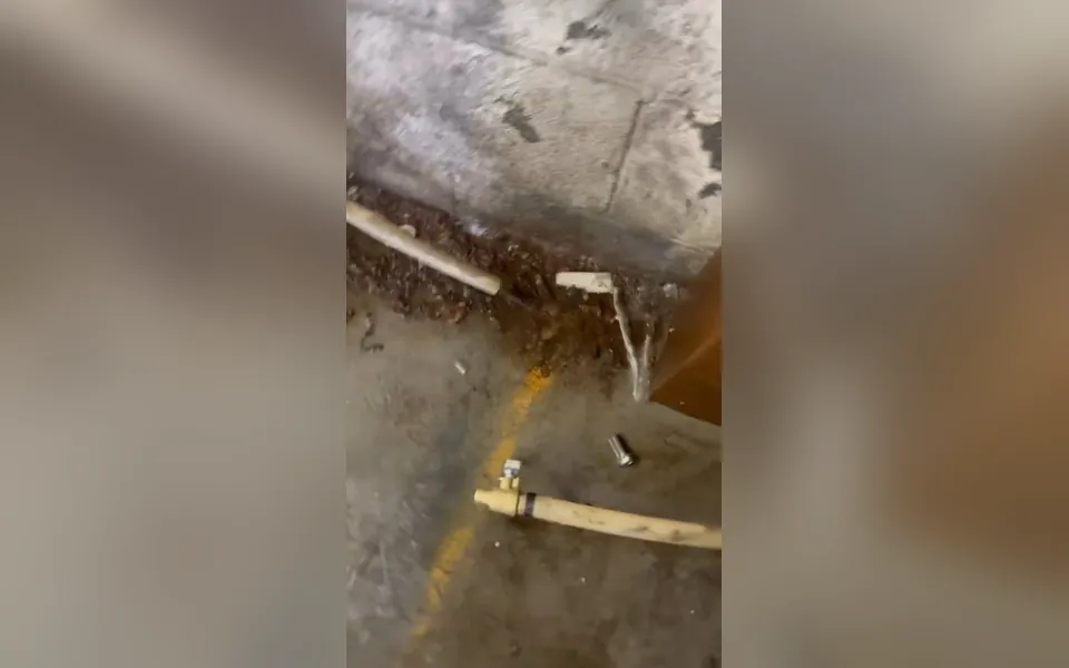 Water pooling where a wall meets the floor for slab leak detection repair in Laguna Niguel